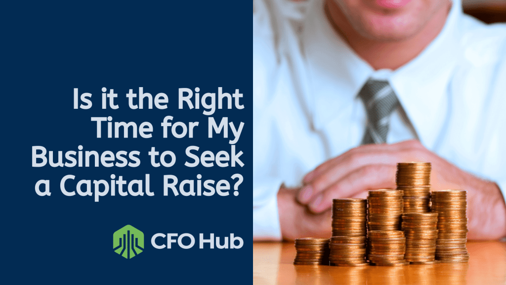 A person in business attire sits behind a table with stacks of coins. The text on the left reads, "Is it the Right Time for My Business to Seek a Capital Raise?" with the CRI CFO Hub logo displayed below.
