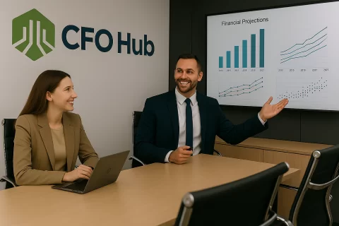 Cfos Presenting In A Boardroom CFOs Presenting In A Boardroom with CRI CFO Hub logo on the wall and financial dashboards on the screen